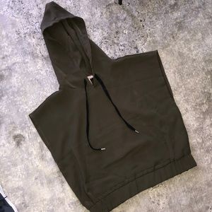 Dark green, hooded/sleeveless top